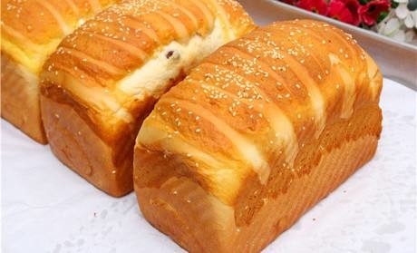 La structure supérieure de pain de gel de promoteur jaunâtre de pain a amplifié le ramollissement rapide de volume de pain
